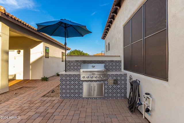 view of patio featuring grilling area and exterior kitchen