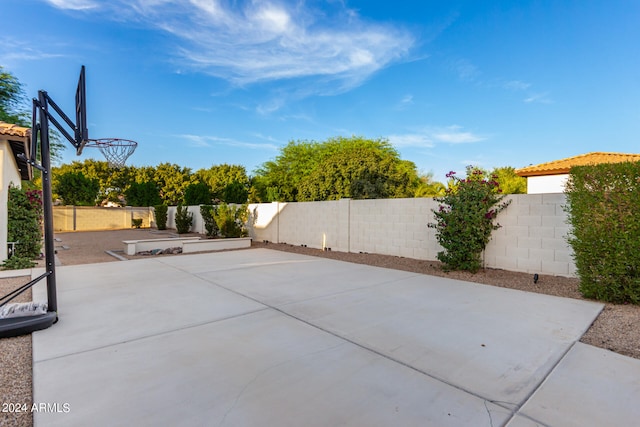 view of patio / terrace featuring basketball hoop