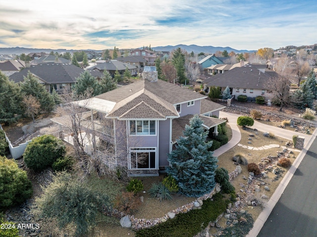 birds eye view of property with a mountain view