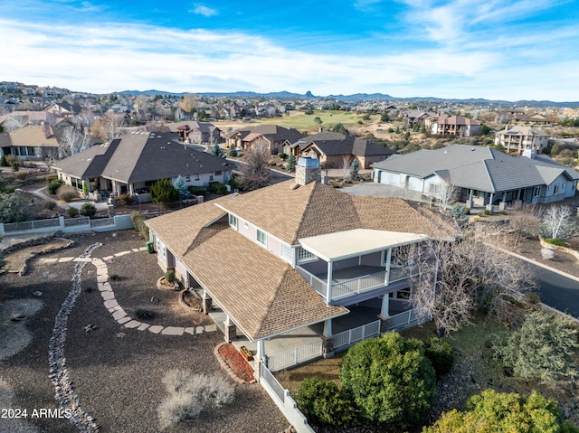 birds eye view of property featuring a mountain view