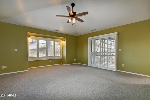 spare room featuring carpet and ceiling fan