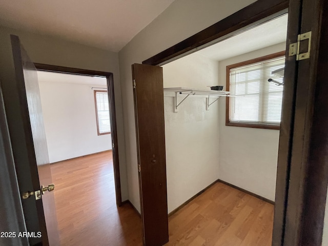 corridor with wood finished floors