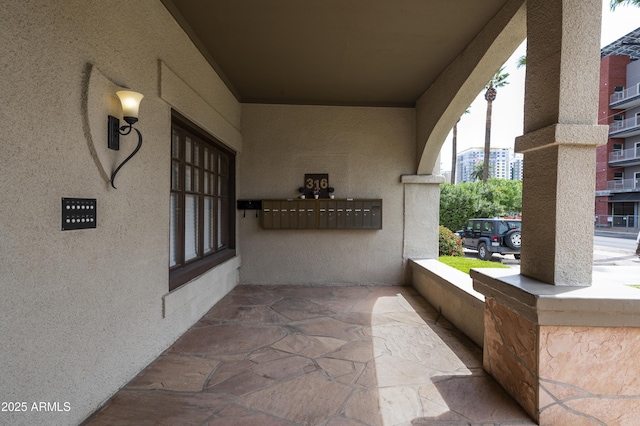 view of patio / terrace with mail area