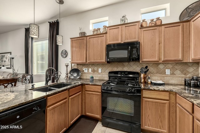 kitchen with black appliances, light tile patterned floors, decorative backsplash, sink, and decorative light fixtures