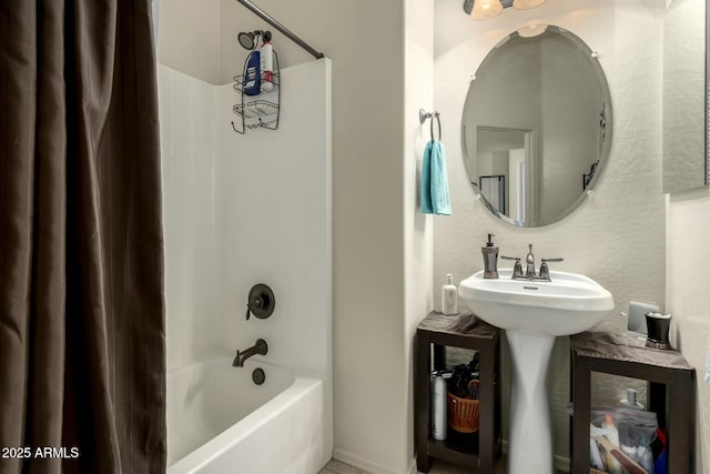 bathroom with sink and bathing tub / shower combination