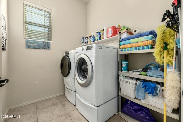 laundry area featuring independent washer and dryer and light tile patterned floors