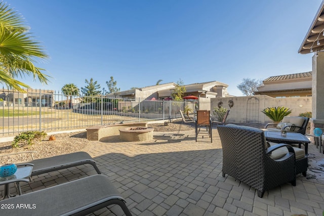 view of patio / terrace with an outdoor fire pit