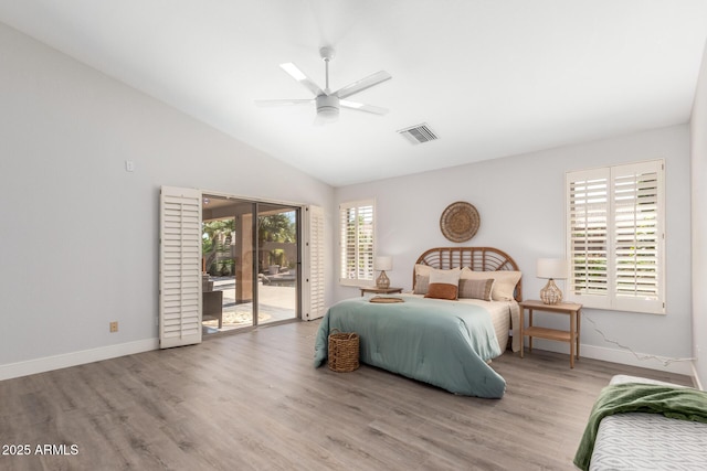 bedroom featuring light wood finished floors, visible vents, vaulted ceiling, access to outside, and baseboards