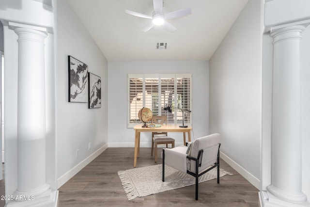 home office featuring decorative columns, visible vents, and a ceiling fan