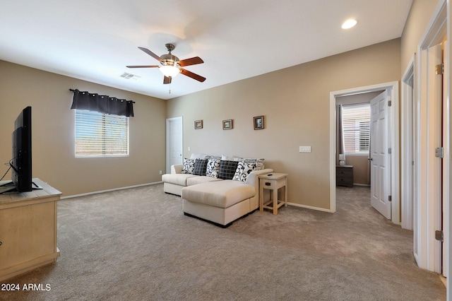 living area featuring recessed lighting, light colored carpet, a ceiling fan, baseboards, and visible vents