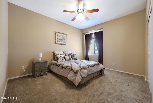 bedroom featuring light colored carpet, ceiling fan, and baseboards