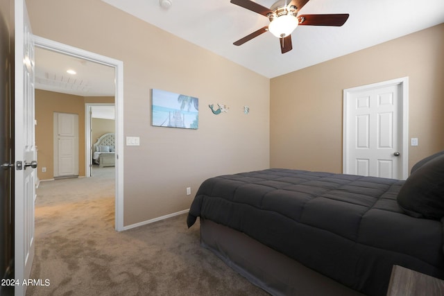 bedroom featuring light colored carpet, ceiling fan, and baseboards