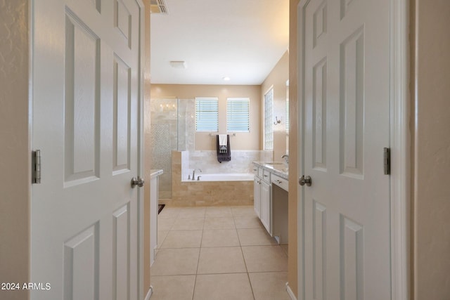 bathroom with a garden tub, visible vents, vanity, tiled shower, and tile patterned floors