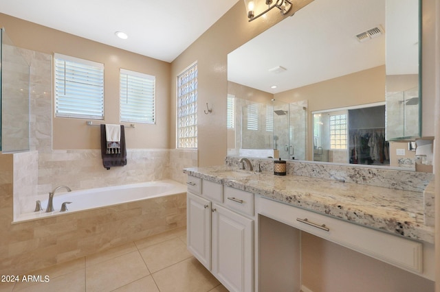 bathroom with a garden tub, visible vents, vanity, a shower stall, and tile patterned flooring