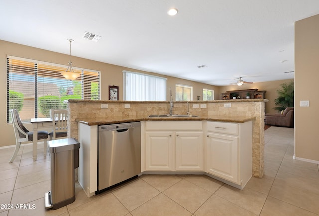 kitchen with a kitchen island with sink, a sink, visible vents, hanging light fixtures, and dishwasher