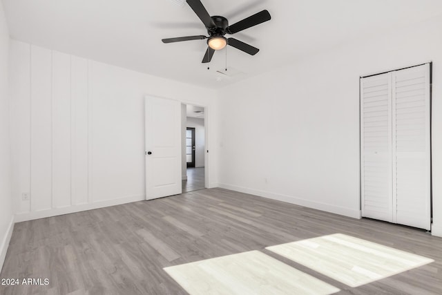 interior space with ceiling fan and light hardwood / wood-style flooring