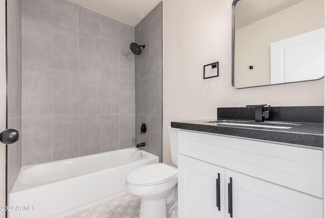 full bathroom with tiled shower / bath combo, vanity, and toilet