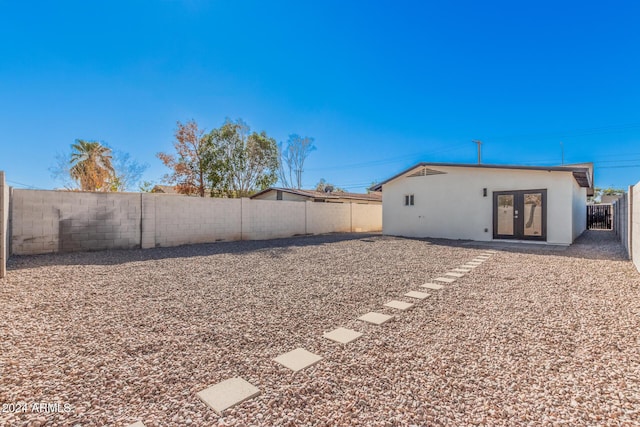 view of yard with french doors