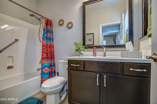 full bathroom featuring shower / bathtub combination with curtain, a textured wall, vanity, and toilet