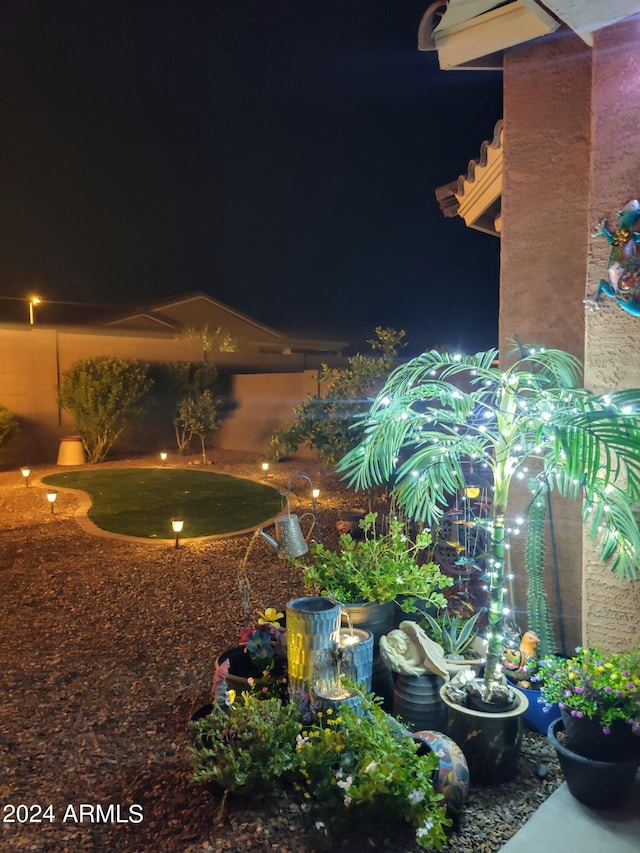 view of yard at twilight