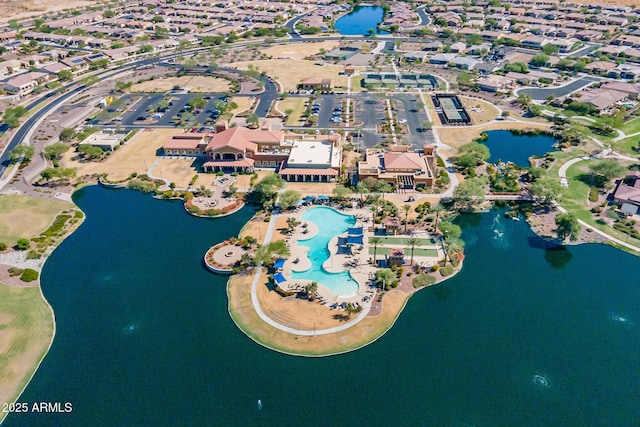 drone / aerial view featuring a water view and a residential view