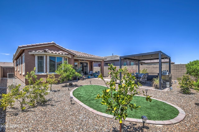 back of house with a patio, a fenced backyard, a tiled roof, and stucco siding