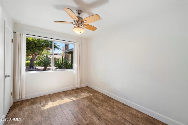 7813 N 17th Dr, Phoenix, AZ 85021 - empty room with wood finished floors, a ceiling fan, and baseboards