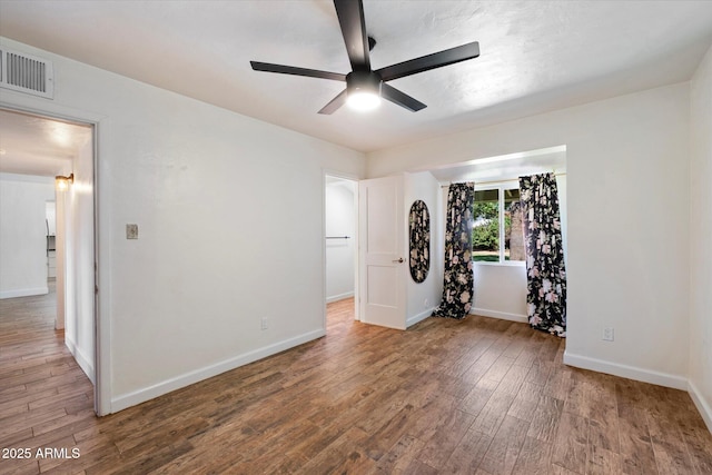 7813 N 17th Dr, Phoenix, AZ 85021 - empty room with a ceiling fan, visible vents, wood finished floors, and baseboards