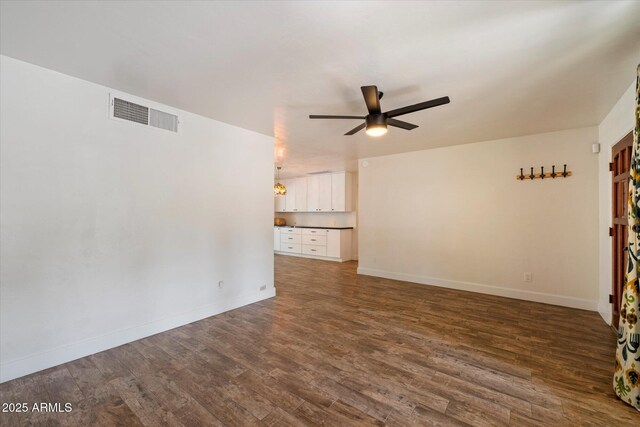 7813 N 17th Dr, Phoenix, AZ 85021 - empty room featuring dark wood-style floors, a ceiling fan, visible vents, and baseboards