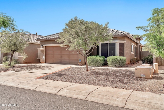 view of front of property with a garage