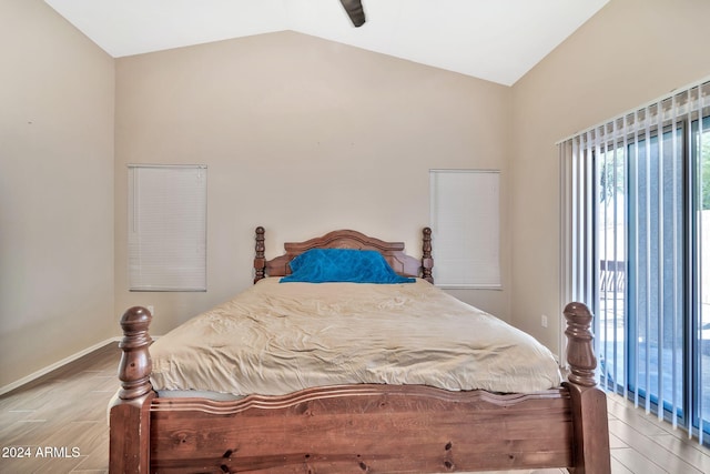 bedroom featuring ceiling fan, vaulted ceiling, and light hardwood / wood-style floors