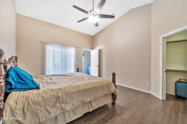 bedroom with vaulted ceiling, dark hardwood / wood-style flooring, and ceiling fan