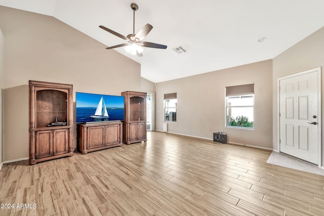 living room with light hardwood / wood-style floors, high vaulted ceiling, and ceiling fan