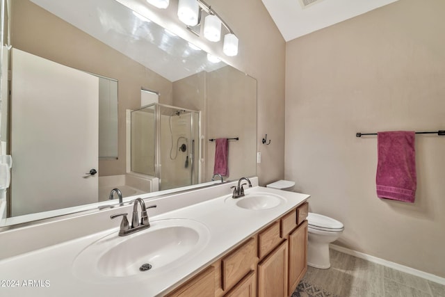 full bathroom with vaulted ceiling, toilet, independent shower and bath, and vanity