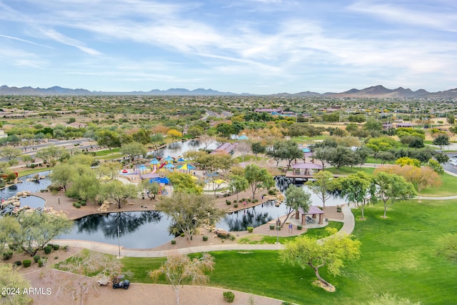 birds eye view of property featuring a water and mountain view