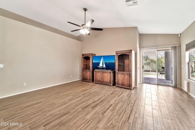 unfurnished living room featuring high vaulted ceiling, light hardwood / wood-style flooring, and ceiling fan