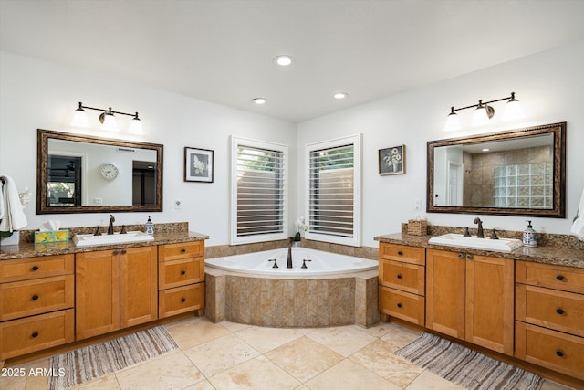 bathroom featuring tile patterned flooring, vanity, and independent shower and bath