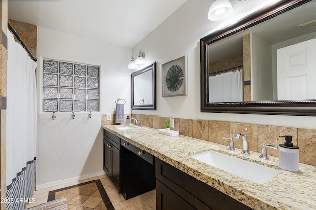 bathroom with tile patterned floors and vanity