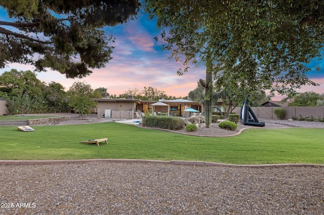 ranch-style house with a lawn