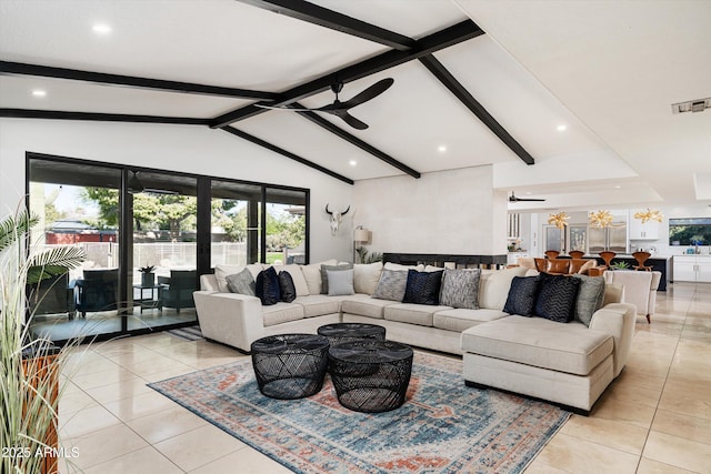 tiled living room featuring vaulted ceiling with beams, ceiling fan, and french doors