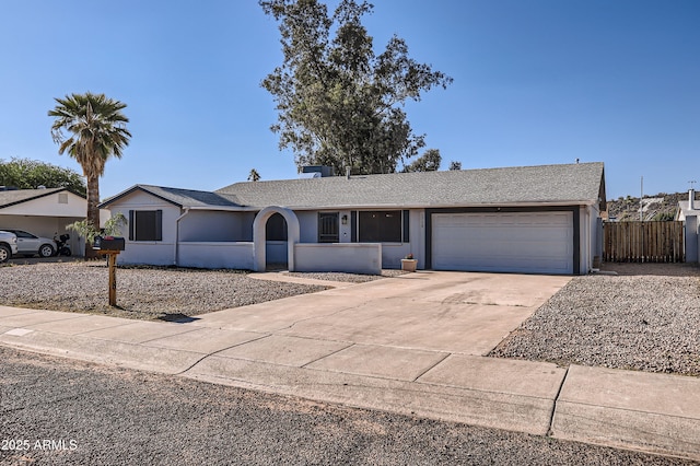 1718 W Voltaire Ave, Phoenix, AZ 85029 - ranch-style house featuring an attached garage, concrete driveway, stucco siding, and roof with shingles