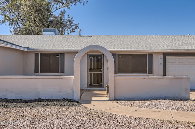 1718 W Voltaire Ave, Phoenix, AZ 85029 - entrance to property featuring a shingled roof and stucco siding