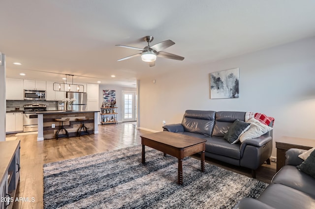 1718 W Voltaire Ave, Phoenix, AZ 85029 - living area with ceiling fan, light wood finished floors, recessed lighting, and baseboards