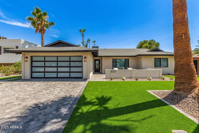 8119 E San Miguel Ave, Scottsdale, AZ 85250 - ranch-style home featuring stucco siding, an attached garage, decorative driveway, and a front lawn