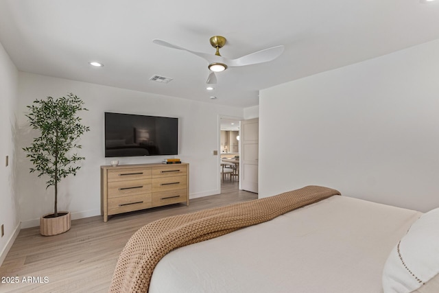 8119 E San Miguel Ave, Scottsdale, AZ 85250 - bedroom featuring light wood-style flooring, a ceiling fan, and recessed lighting