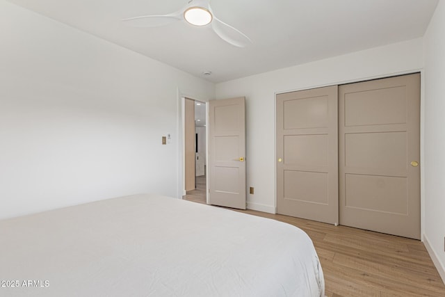 8119 E San Miguel Ave, Scottsdale, AZ 85250 - bedroom with light wood-style flooring, ceiling fan, and a closet