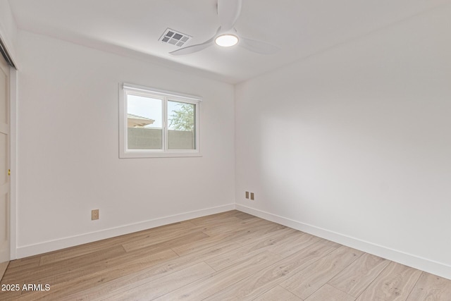 8119 E San Miguel Ave, Scottsdale, AZ 85250 - unfurnished bedroom with light wood-style flooring, a closet, and a ceiling fan