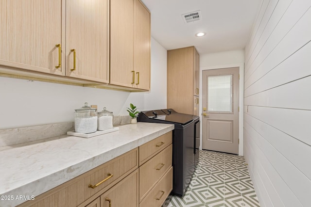 8119 E San Miguel Ave, Scottsdale, AZ 85250 - laundry room with washer and clothes dryer, cabinet space, recessed lighting, and wooden walls