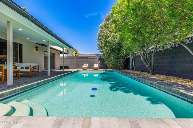 8119 E San Miguel Ave, Scottsdale, AZ 85250 - view of swimming pool featuring a fenced backyard, outdoor lounge area, and a patio