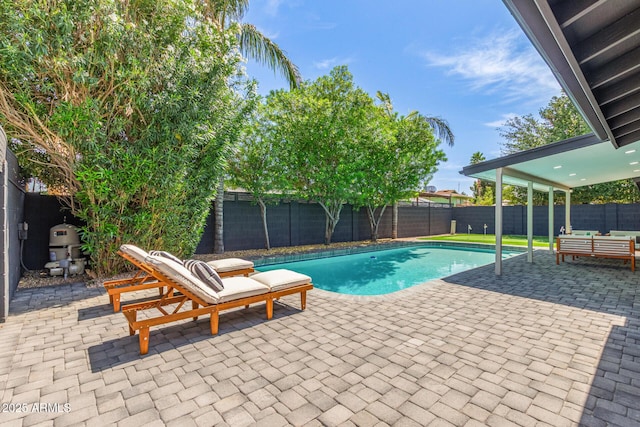8119 E San Miguel Ave, Scottsdale, AZ 85250 - view of pool featuring a patio area, a fenced backyard, and an outdoor hangout area